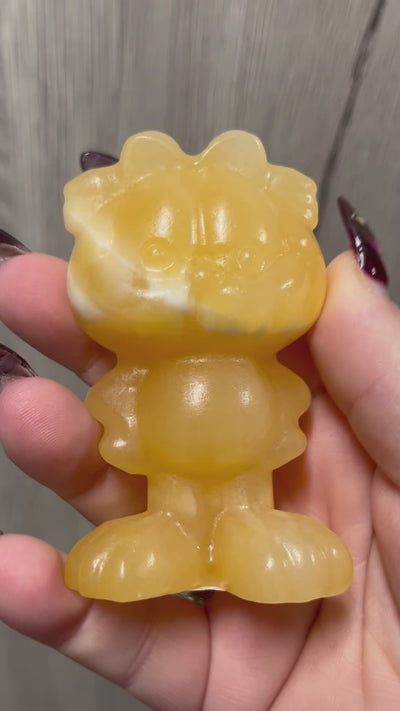 Orange Calcite Lasagna Lover Character Carving